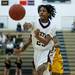 Dexter junior London Truman passes in the first half against Ypsilanti on Friday, Feb. 15. Daniel Brenner I AnnArbor.com